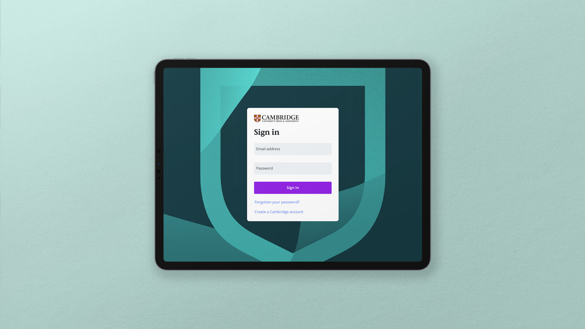 A tablet on a turquoise background showing a sign in screen.